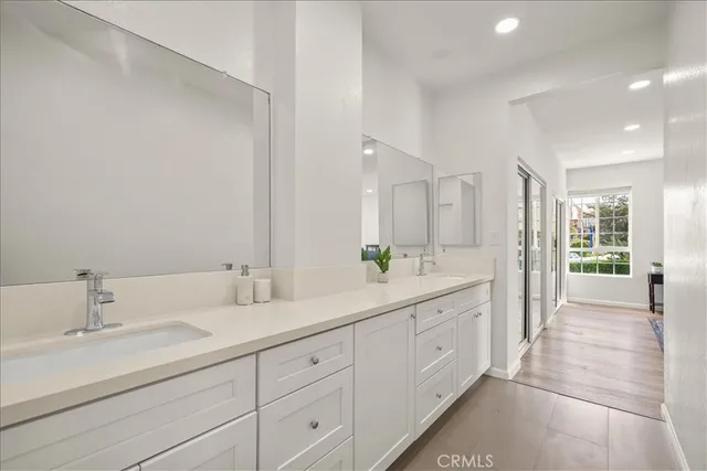 a bathroom with a shower and a glass door
