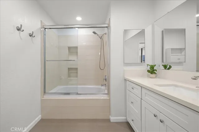 an empty room with furniture and windows