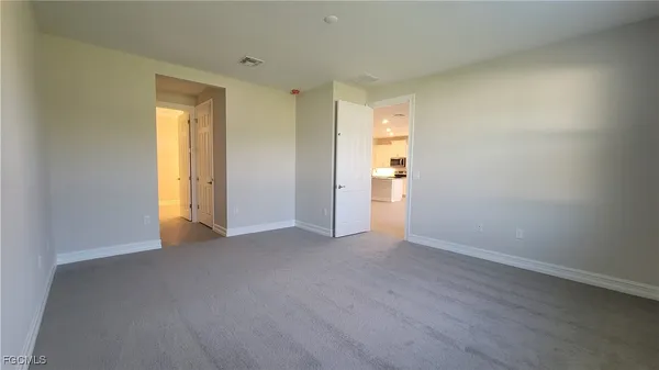 a view of an empty room and window
