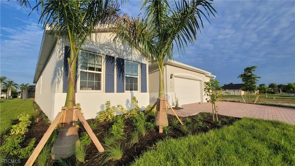 front view of a house with a yard