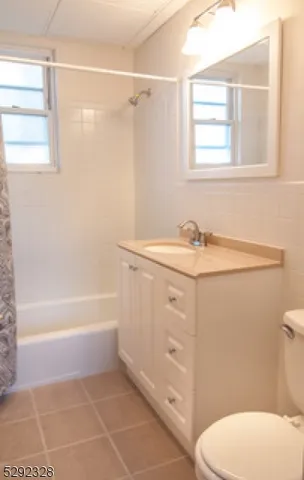 a bathroom with a sink a toilet and bathtub