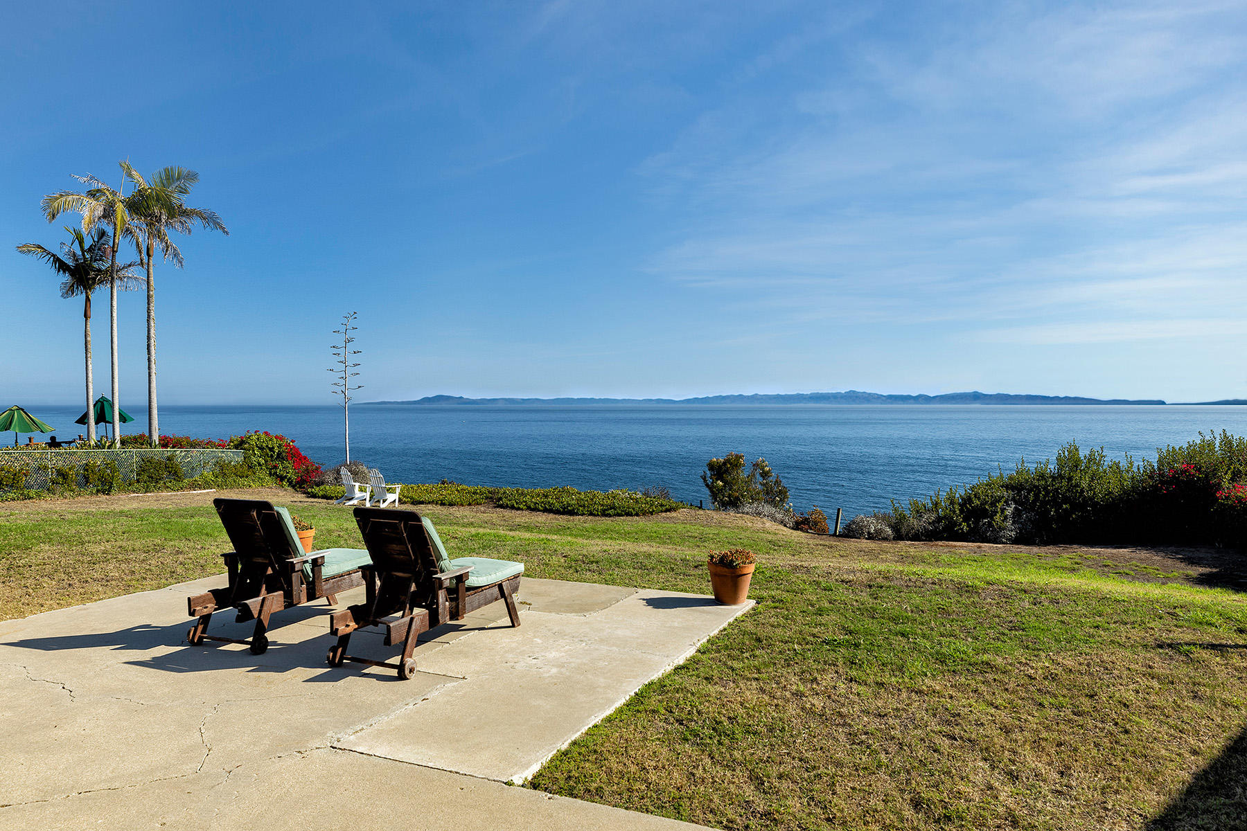 a view of a swimming pool and lounge chair