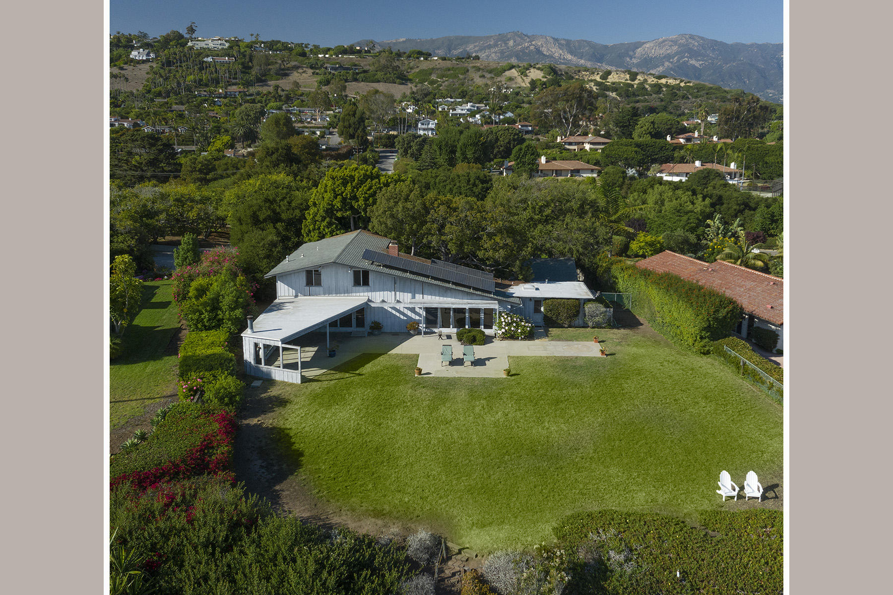3239 Cliff Drive Santa Barbara, CA 93109 - Photo 4 of 8 an aerial view of a house with yard swimming pool and mountains