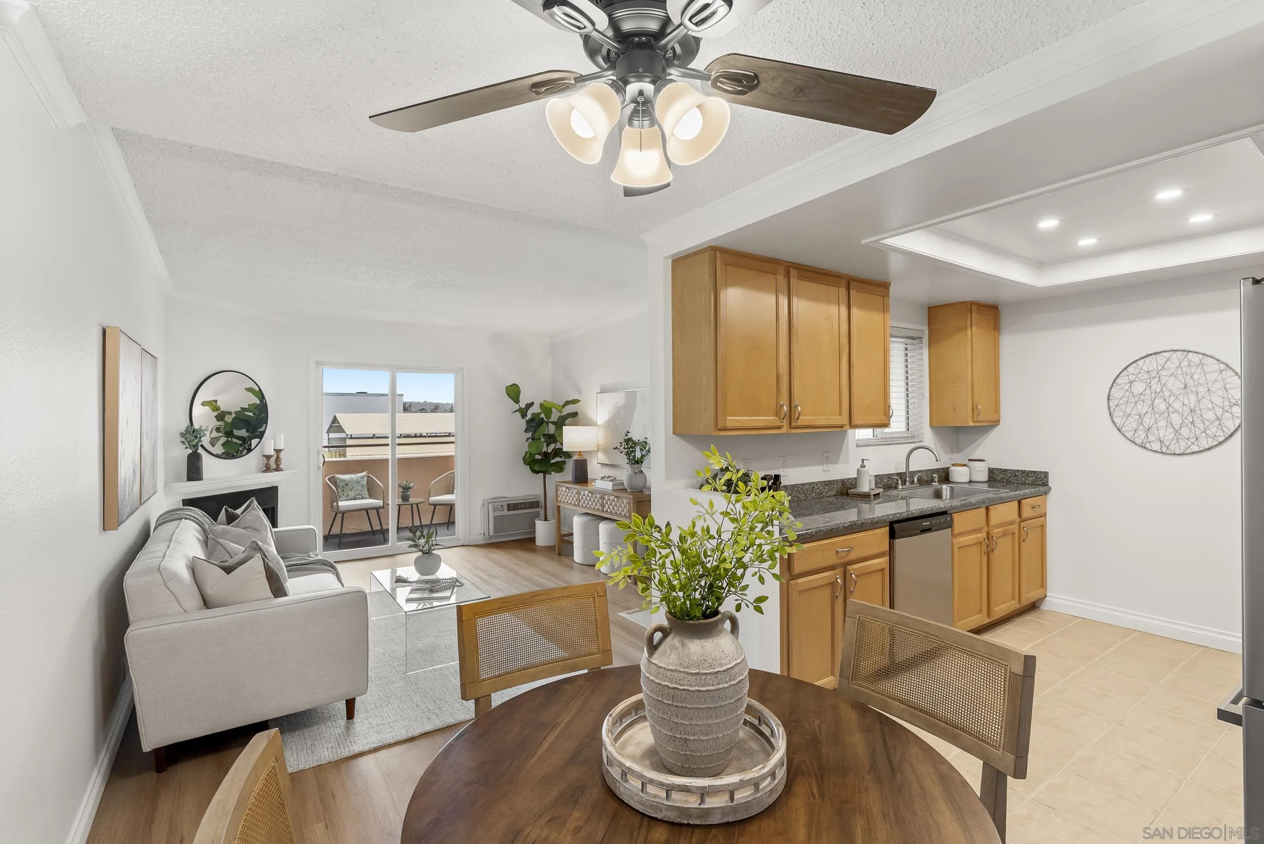 830 Broadway, Unit 15 El Cajon, CA 92021 - Photo 10 of 21 a living room with furniture a chandelier and a dining table