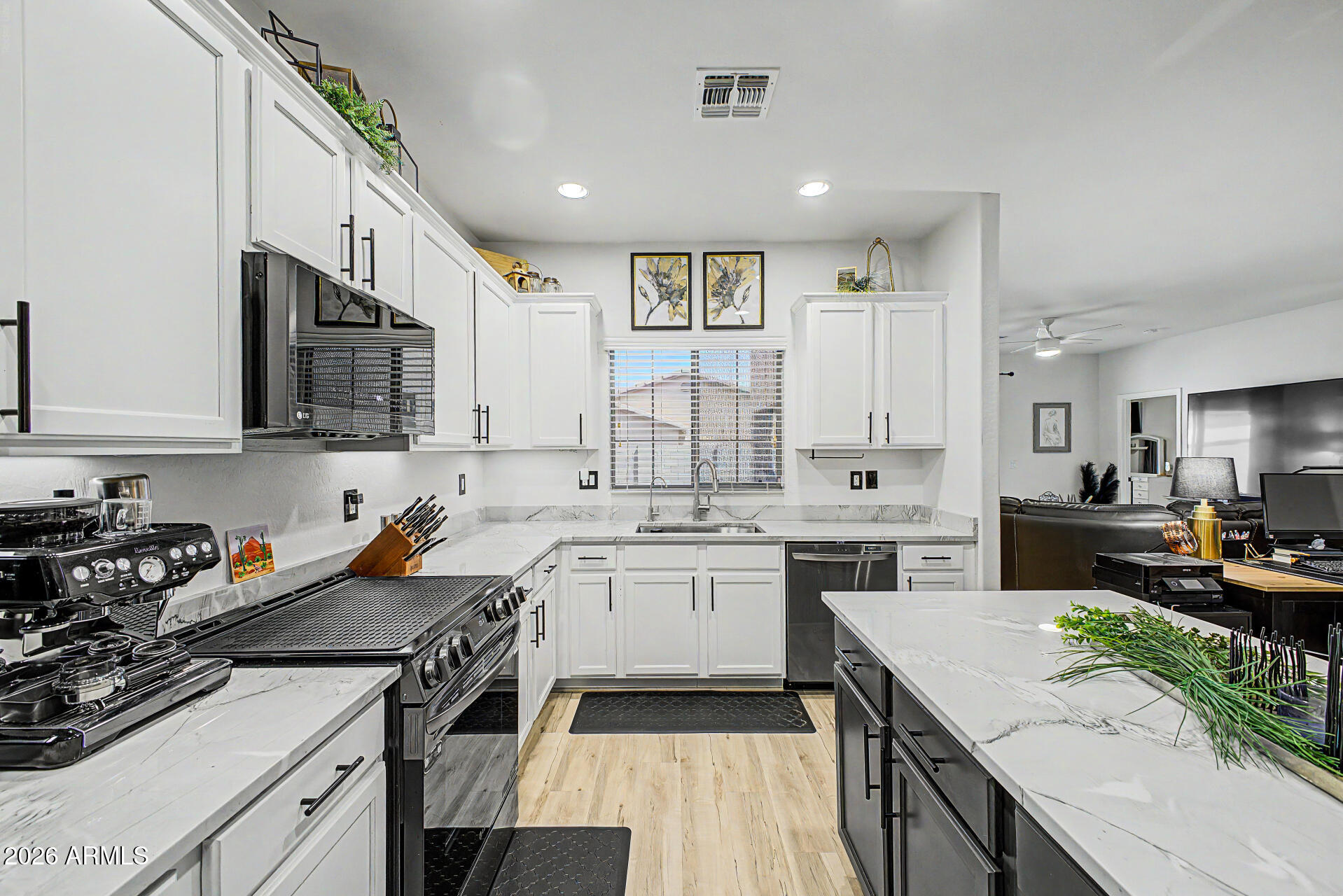 4924 West Harwell Road Laveen, AZ 85339 - Photo 12 of 27 a kitchen with a sink stove and cabinets
