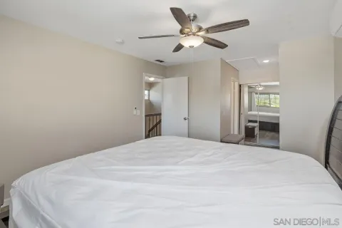 a large white bed in a white room