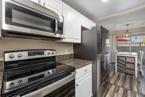 a kitchen with appliances and cabinets