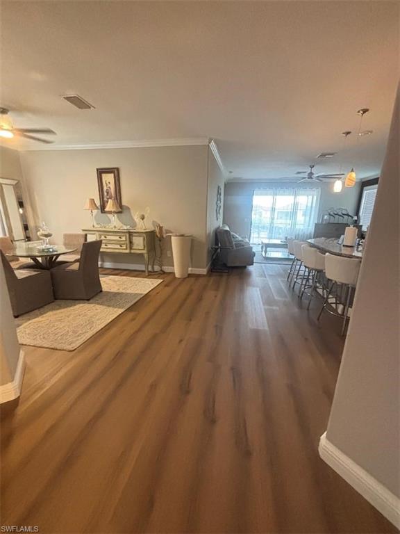 1599 Marton Court Naples, FL 34113 - Photo 5 of 22 a living room with furniture and a wooden floor