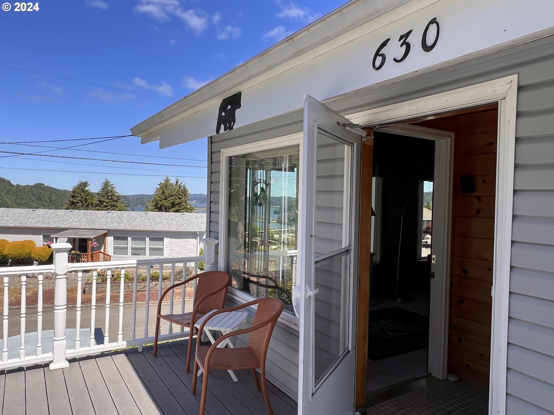 630 Crestview Drive Reedsport, OR 97467 - Photo 13 of 44 a view of a chairs and a roof deck