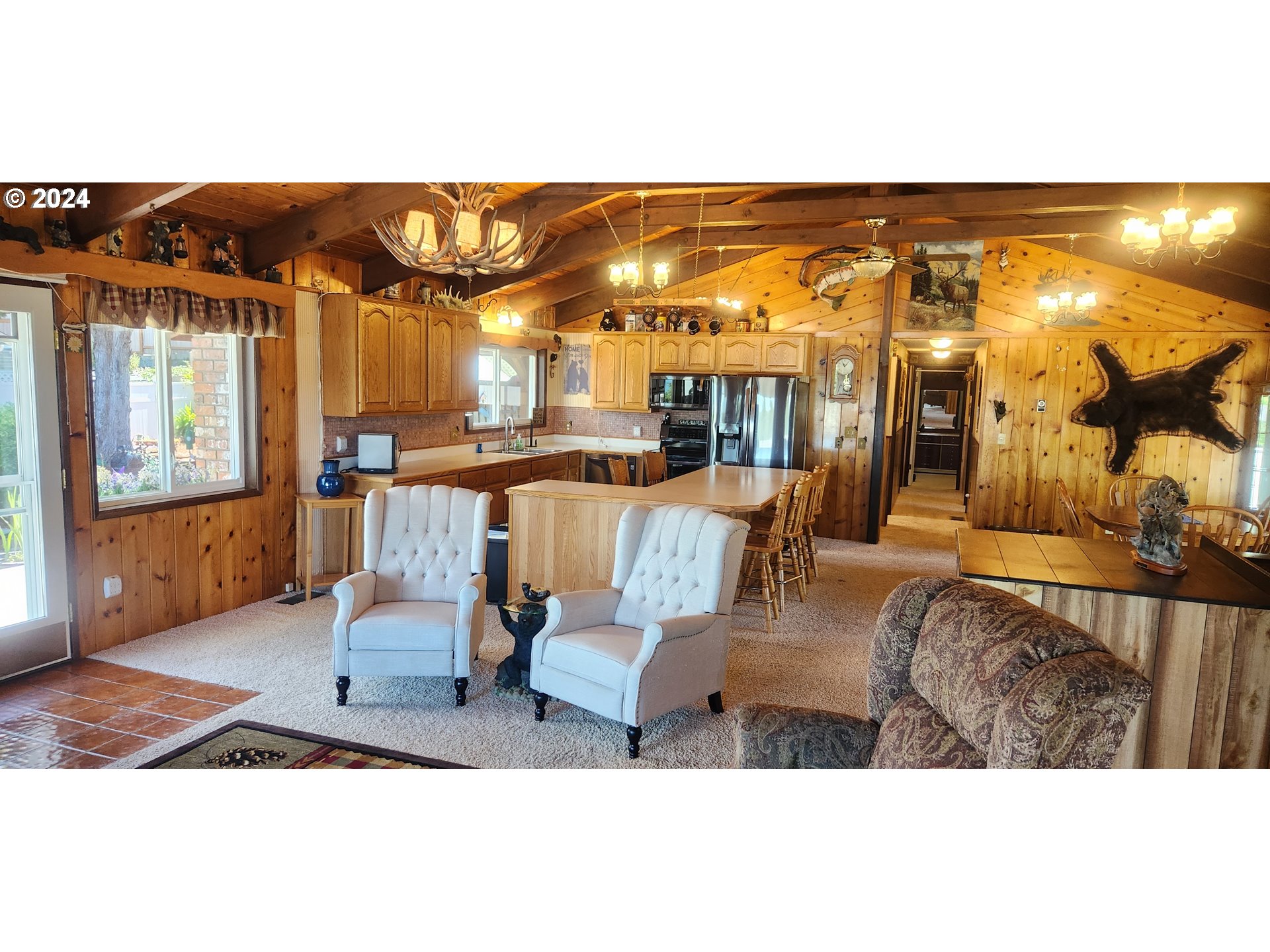 630 Crestview Drive Reedsport, OR 97467 - Photo 16 of 44 a view of a living room and dining room