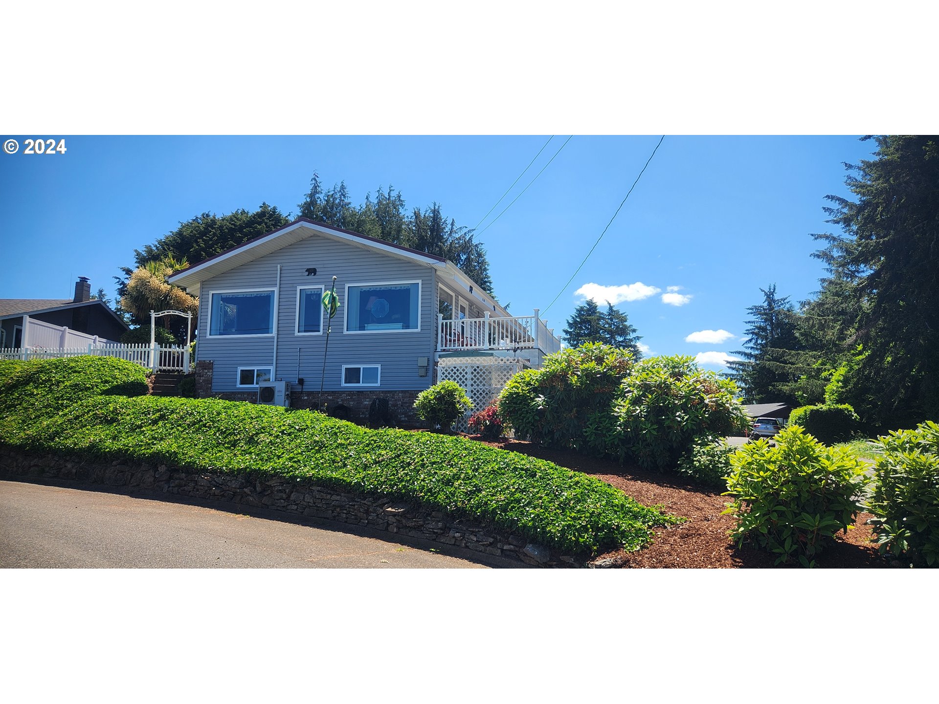 630 Crestview Drive Reedsport, OR 97467 - Photo 3 of 44 a front view of a house with a yard