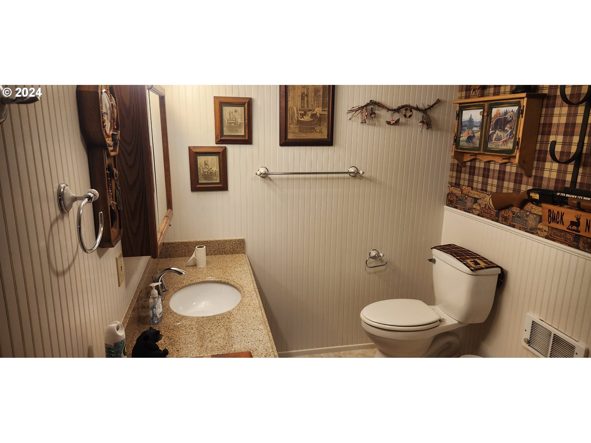630 Crestview Drive Reedsport, OR 97467 - Photo 39 of 44 a bathroom with a toilet sink shower and mirror
