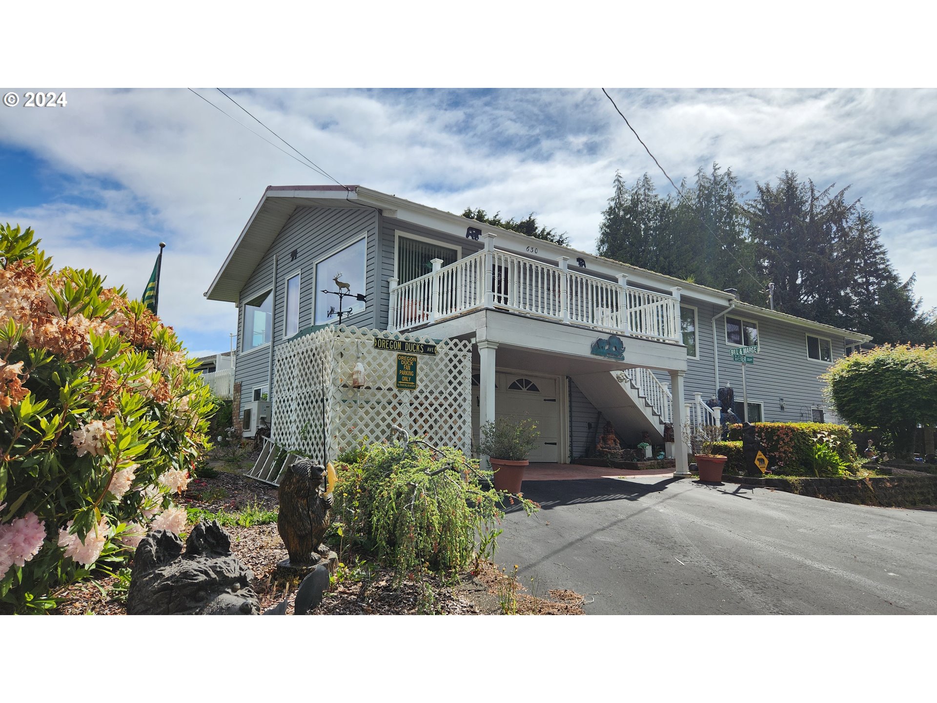630 Crestview Drive Reedsport, OR 97467 - Photo 43 of 44 a black and white house with a yard