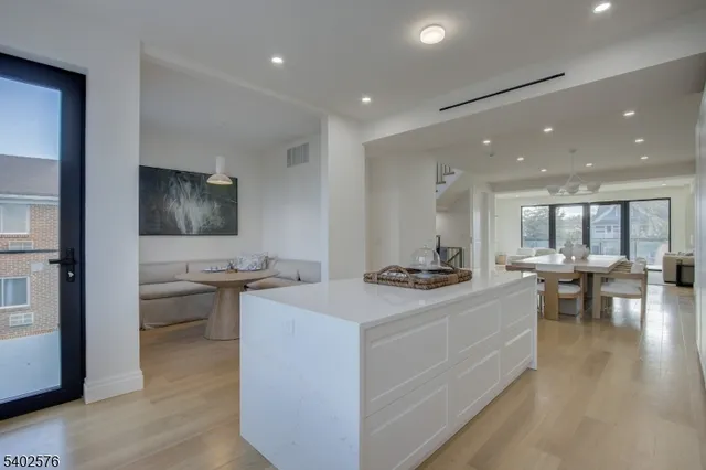 a kitchen with stainless steel appliances granite countertop a stove and a sink