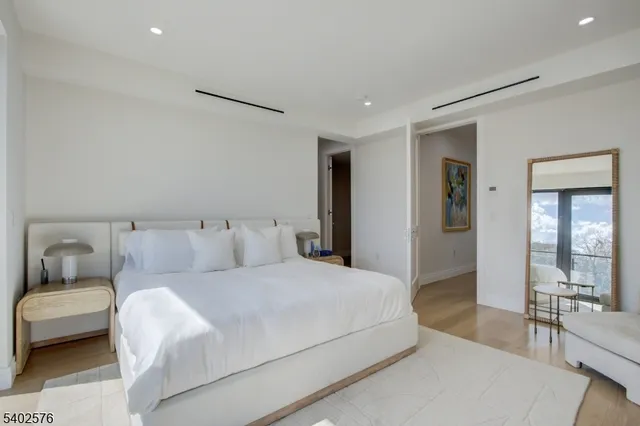 a bedroom with a bed and a couch