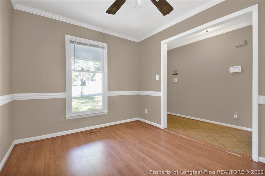 5090 Summer Ridge Road Fayetteville, NC 28303 - Photo 6 of 30 an empty room with wooden floor and windows
