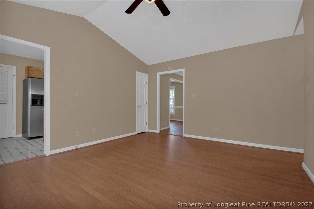 5090 Summer Ridge Road Fayetteville, NC 28303 - Photo 8 of 30 a view of an empty room with window and wooden floor