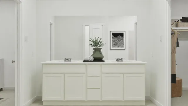 a bathroom with a sink a mirror and vanity