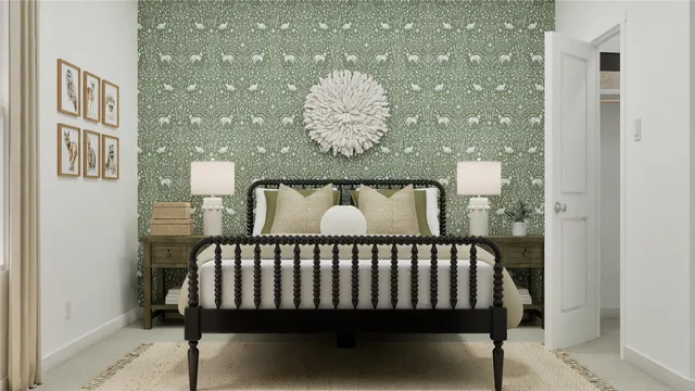 a bed sitting in a bedroom next to a bathroom