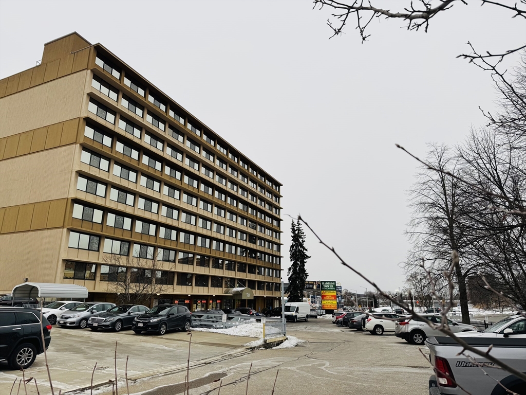 a view of building with parking