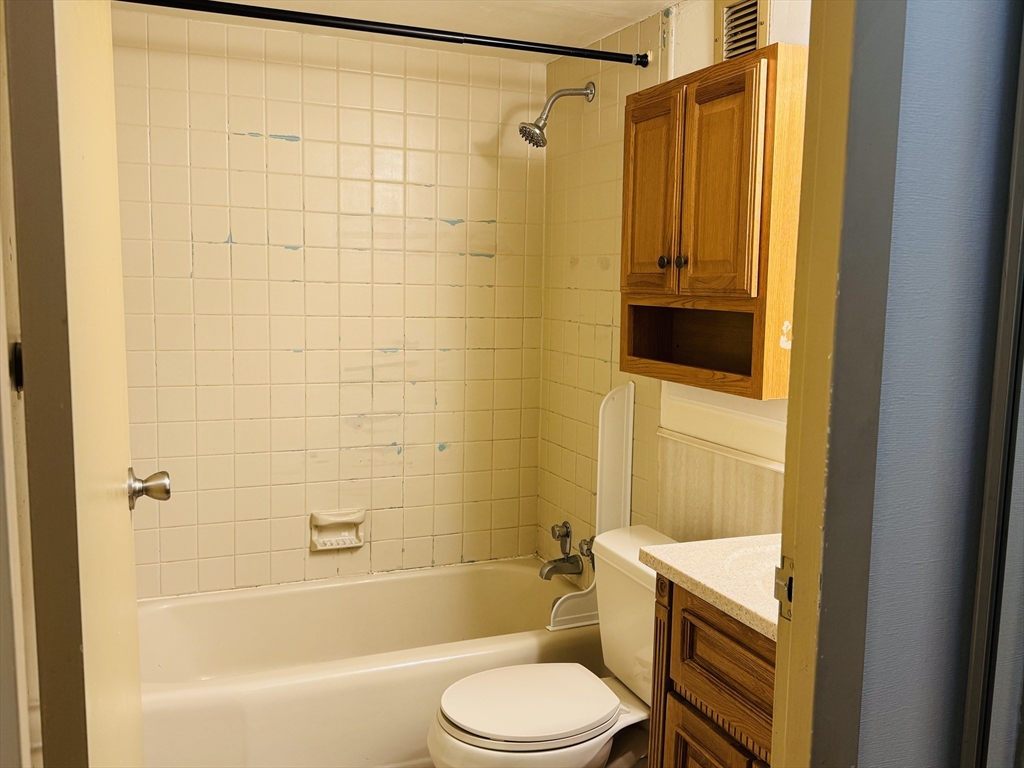 70 Southbridge Street, Unit 504 Worcester, MA 01608 - Photo 11 of 15 a bathroom with a toilet and shower
