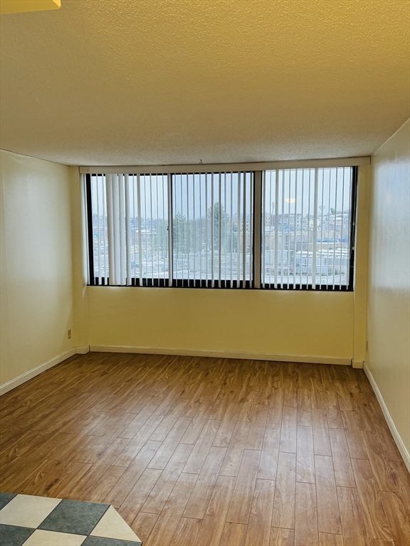 70 Southbridge Street, Unit 504 Worcester, MA 01608 - Photo 6 of 15 a view of a room with wooden floor and window