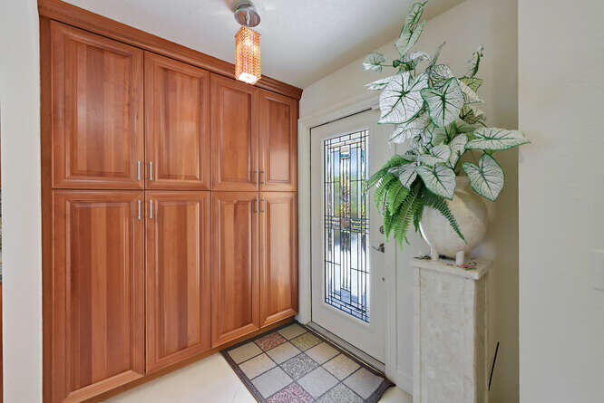 150 Beach Summit Court Jupiter, FL 33477 - Photo 11 of 31 Foyer etched glass impact front door