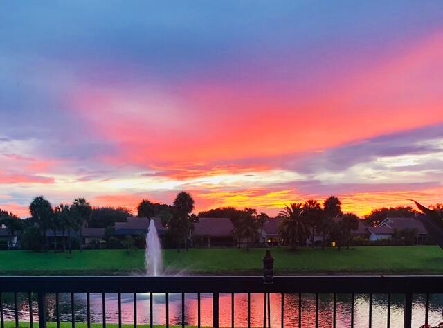 150 Beach Summit Court Jupiter, FL 33477 - Photo 20 of 31 Sunset from rear yard overlooking lake