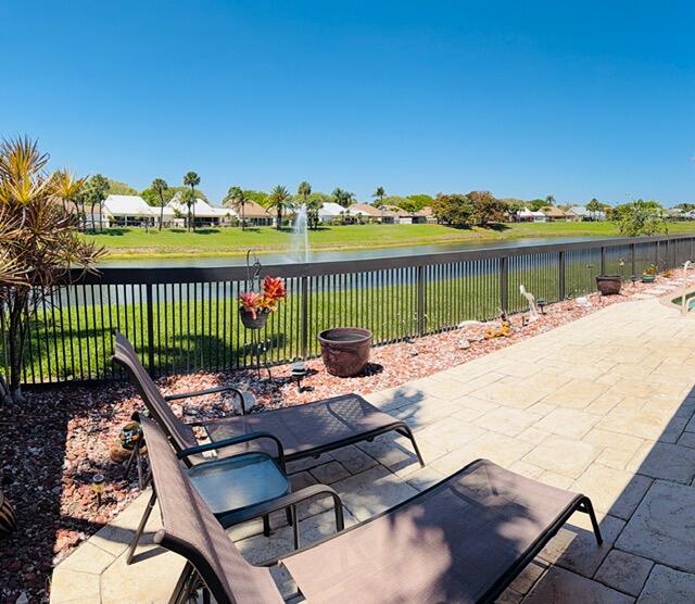 150 Beach Summit Court Jupiter, FL 33477 - Photo 27 of 31 Pool overlooks water with lit fountain