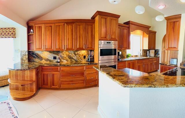 150 Beach Summit Court Jupiter, FL 33477 - Photo 9 of 31 Kitchen open to LR