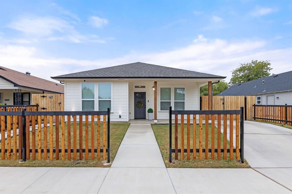 1530 East Cannon Street Fort Worth, TX 76104 - Photo 1 of 16 front view of a house with a balcony