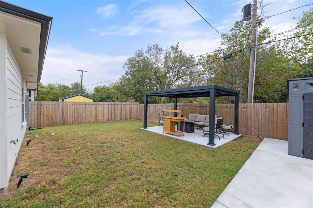 1530 East Cannon Street Fort Worth, TX 76104 - Photo 14 of 16 a view of a backyard with sitting area and slide