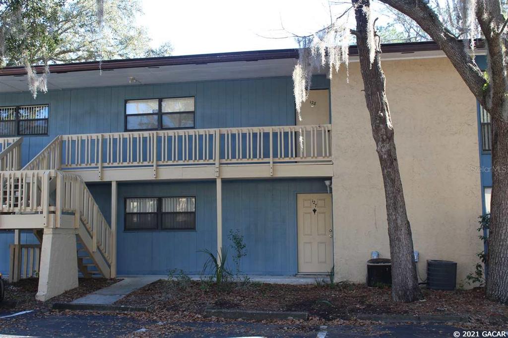 2811 Southwest Archer Road, Unit P127 Gainesville, FL 32608 - Photo 1 of 1 a view of a house with a door