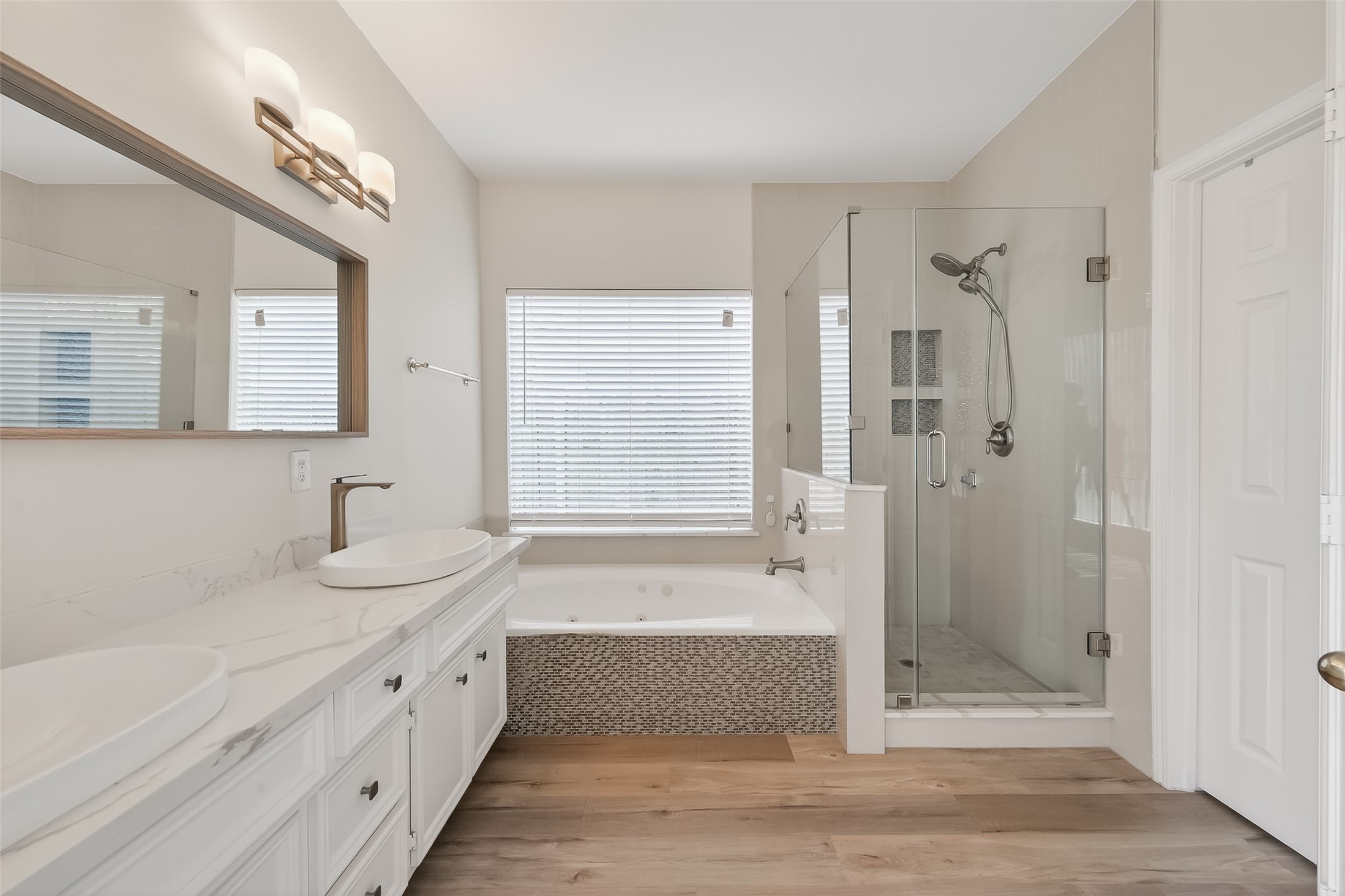 4111 Creek Ridge Lane Missouri City, TX 77459 - Photo 22 of 43 What a pretty, bright bathroom! Big double vanity, separate tub and shower are all fantastic features.