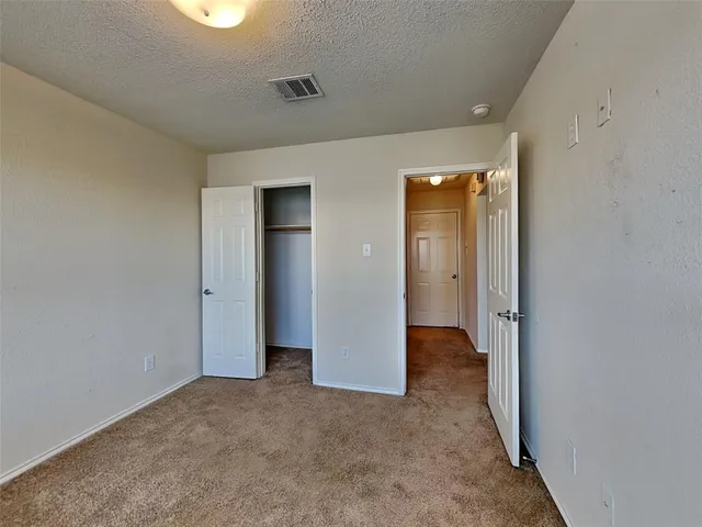 an empty room with closet