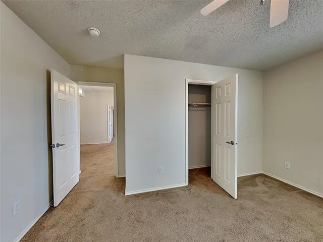 a view of hallway with closet area