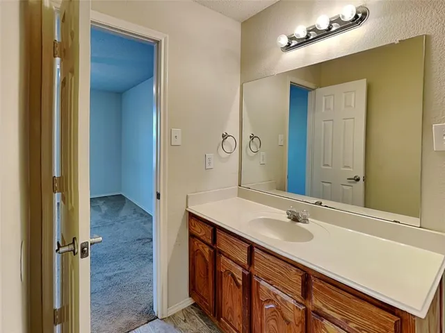 a bathroom with a sink double vanity and a mirror