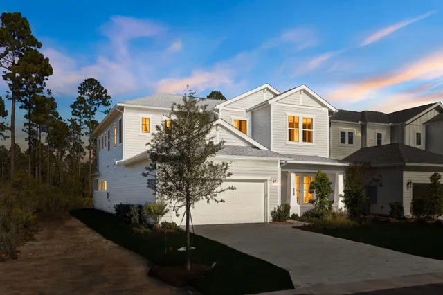 a large kitchen with kitchen island a large counter top space a sink stainless steel appliances and cabinets