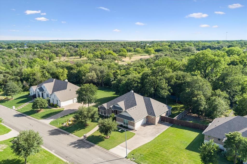 128 Creek Ridge Drive Waco, TX 76708 - Photo 2 of 40 View from above of property with a forest