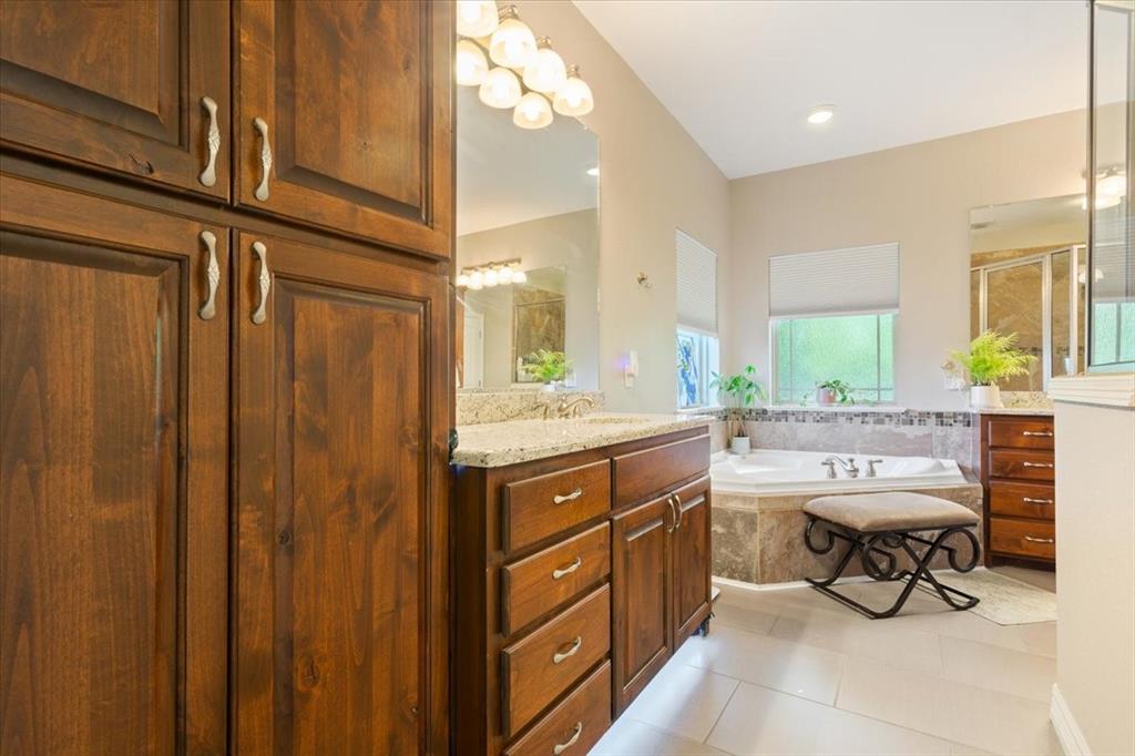 128 Creek Ridge Drive Waco, TX 76708 - Photo 21 of 40 Full bathroom featuring a shower stall, vanity, a garden tub, and tile patterned flooring