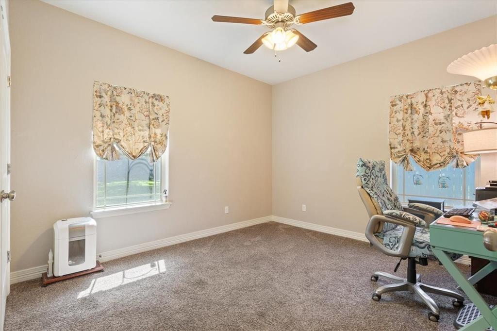 128 Creek Ridge Drive Waco, TX 76708 - Photo 30 of 40 Unfurnished office with carpet flooring, a ceiling fan, heating unit, and baseboards