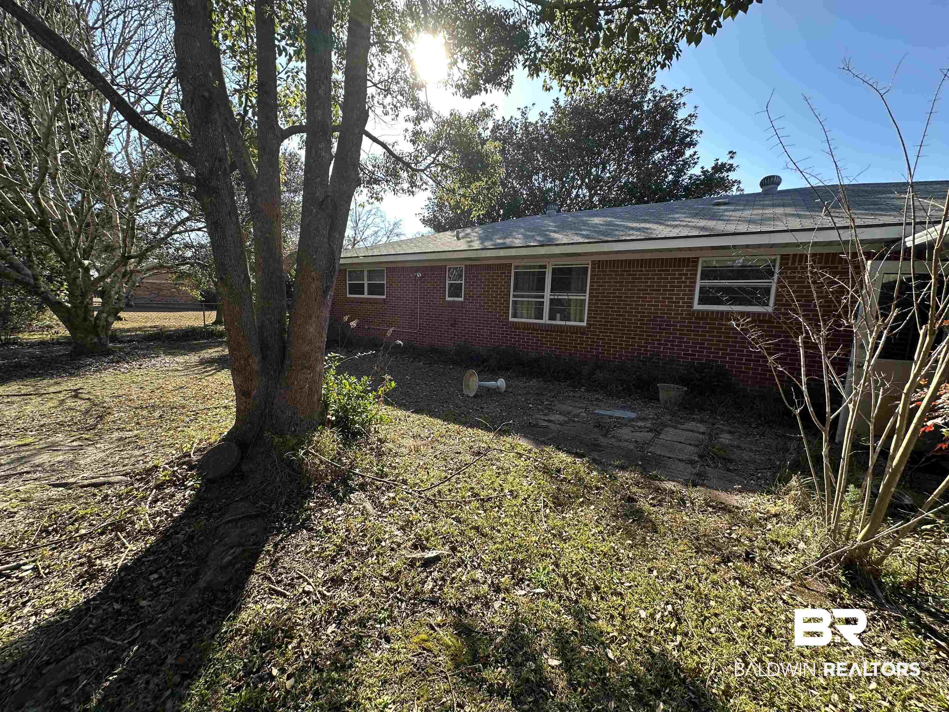 1 Yupon Circle Foley, AL 36535 - Photo 30 of 30 View of side of home with brick siding and a patio