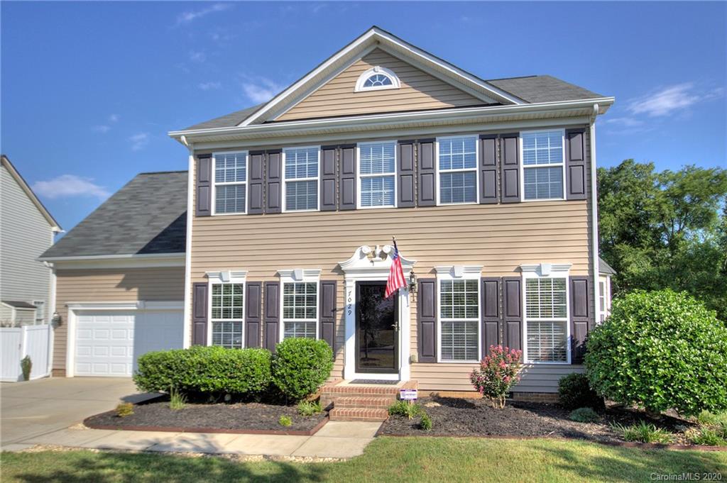 7029 Meyer Road Fort Mill, SC 29715 - Photo 1 of 42 a front view of a house with a yard