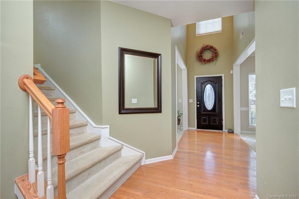 7029 Meyer Road Fort Mill, SC 29715 - Photo 5 of 42 a view of a hallway with wooden floor and entryway