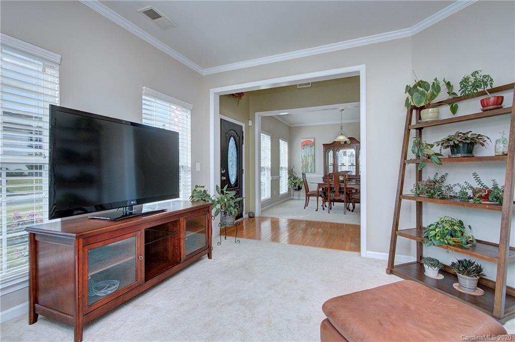 7029 Meyer Road Fort Mill, SC 29715 - Photo 10 of 42 a living room with furniture and a flat screen tv