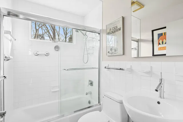 a bathroom with a bathtub and a shower