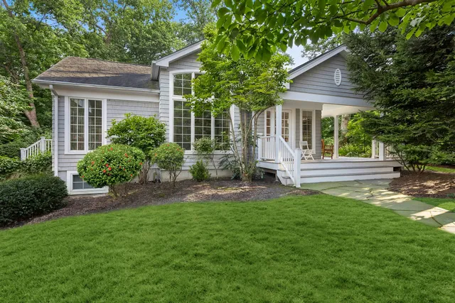 a view of a house with a yard and plants