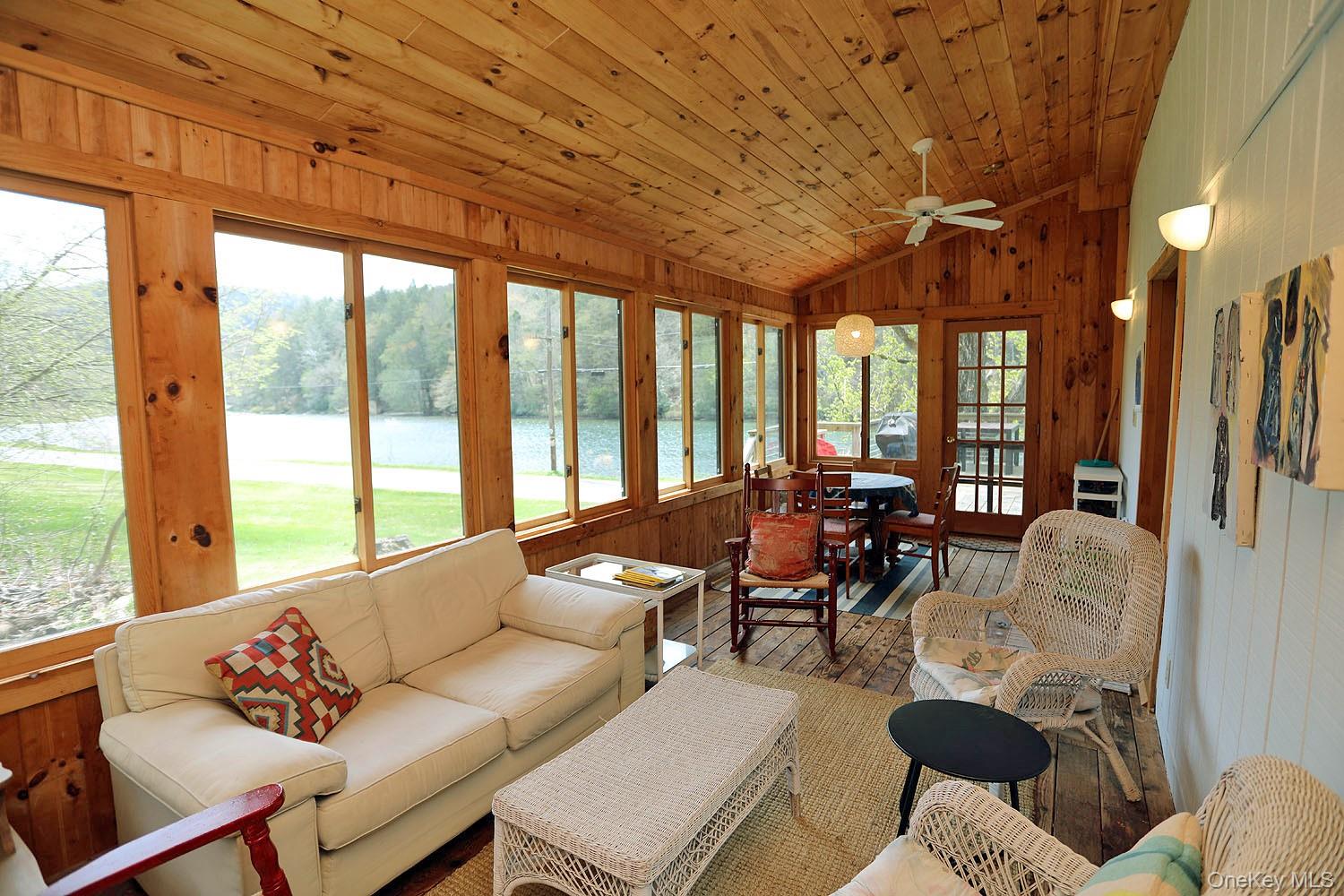 5120 Peas Eddy Road Hancock, NY 13783 - Photo 8 of 37 a living room with furniture and large windows