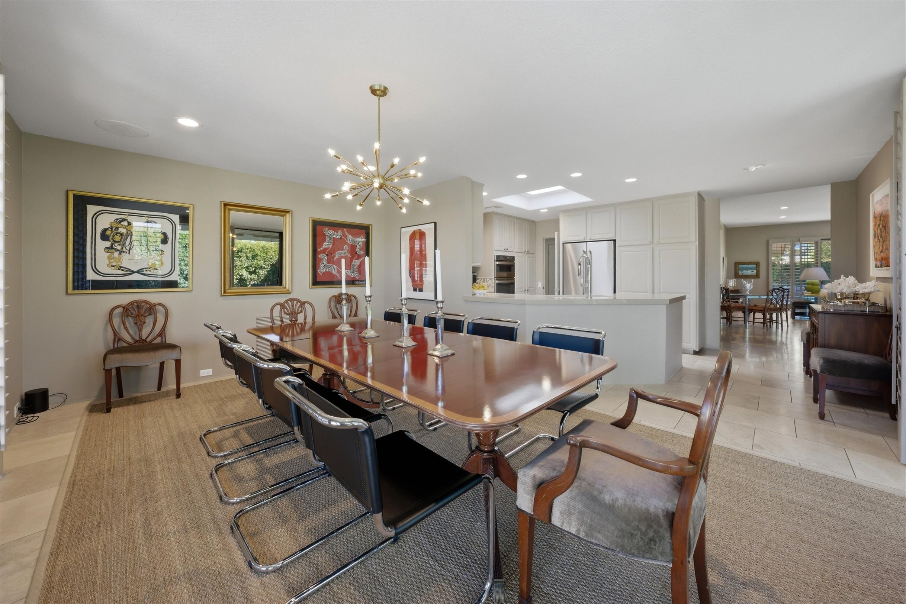 3 Barnard Court Rancho Mirage, CA 92270 - Photo 16 of 47 a large kitchen with a table and chairs