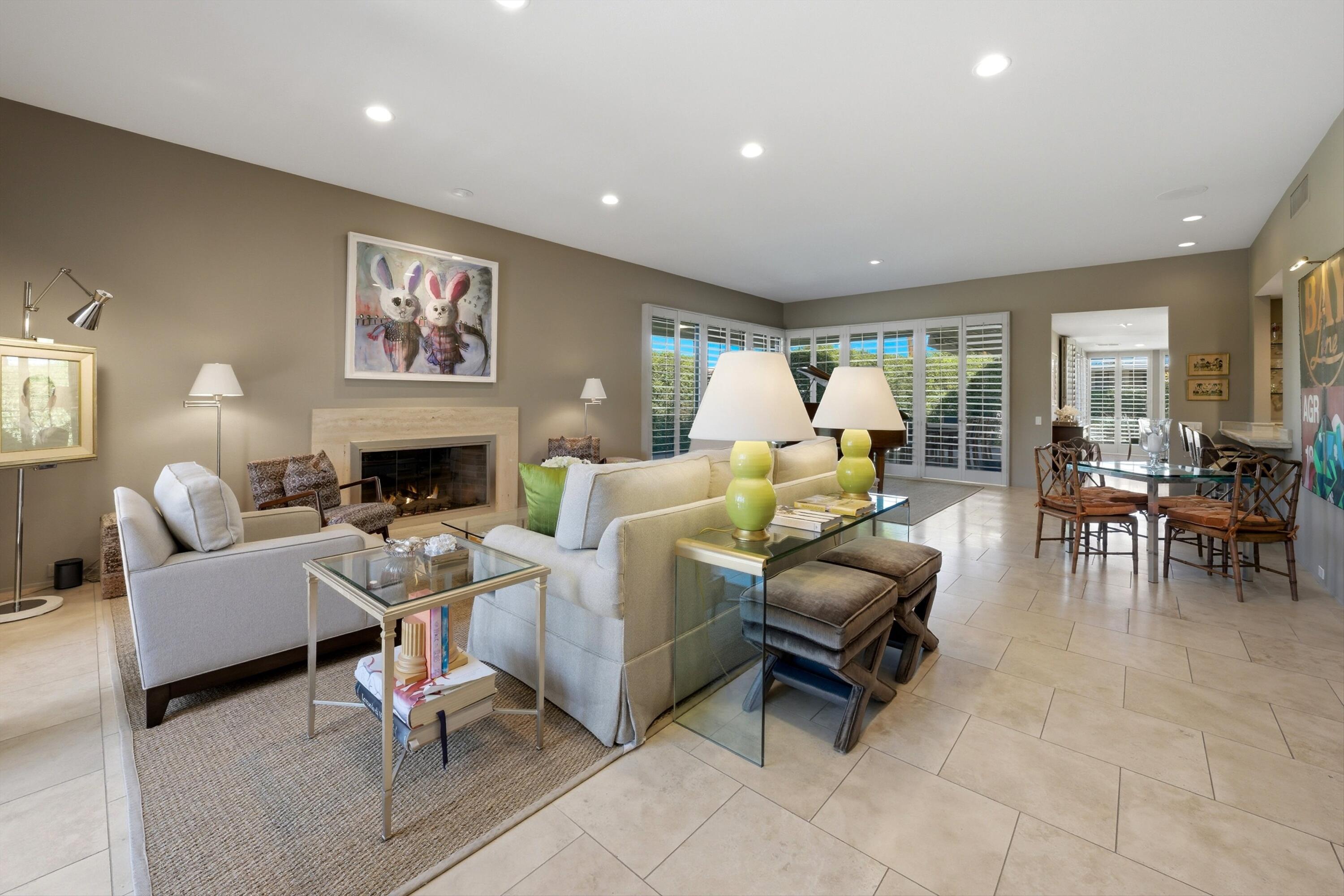 3 Barnard Court Rancho Mirage, CA 92270 - Photo 2 of 47 a living room with furniture and a fireplace